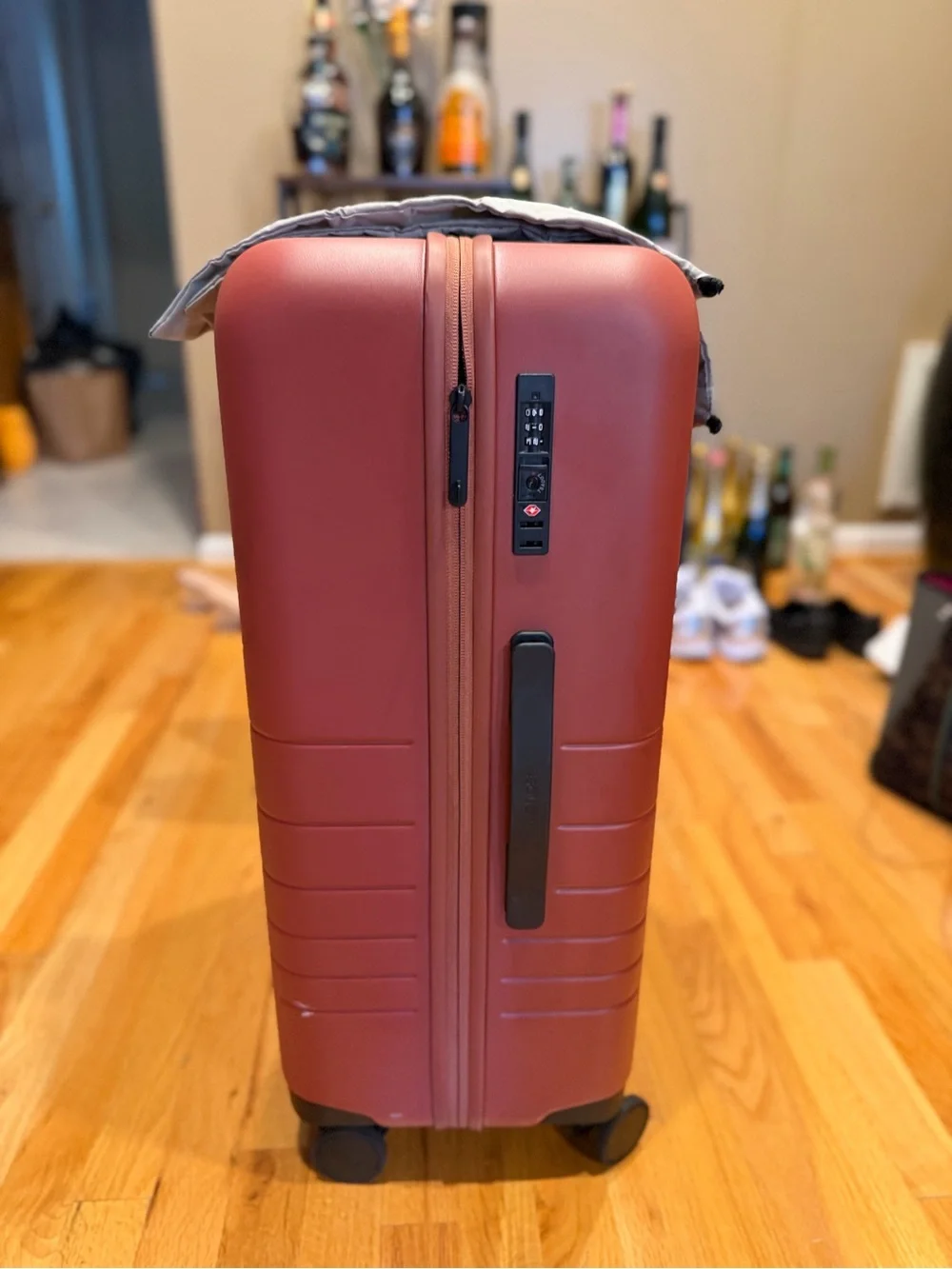 Monos medium check in 24” terracotta color suitcase LIKE NEW